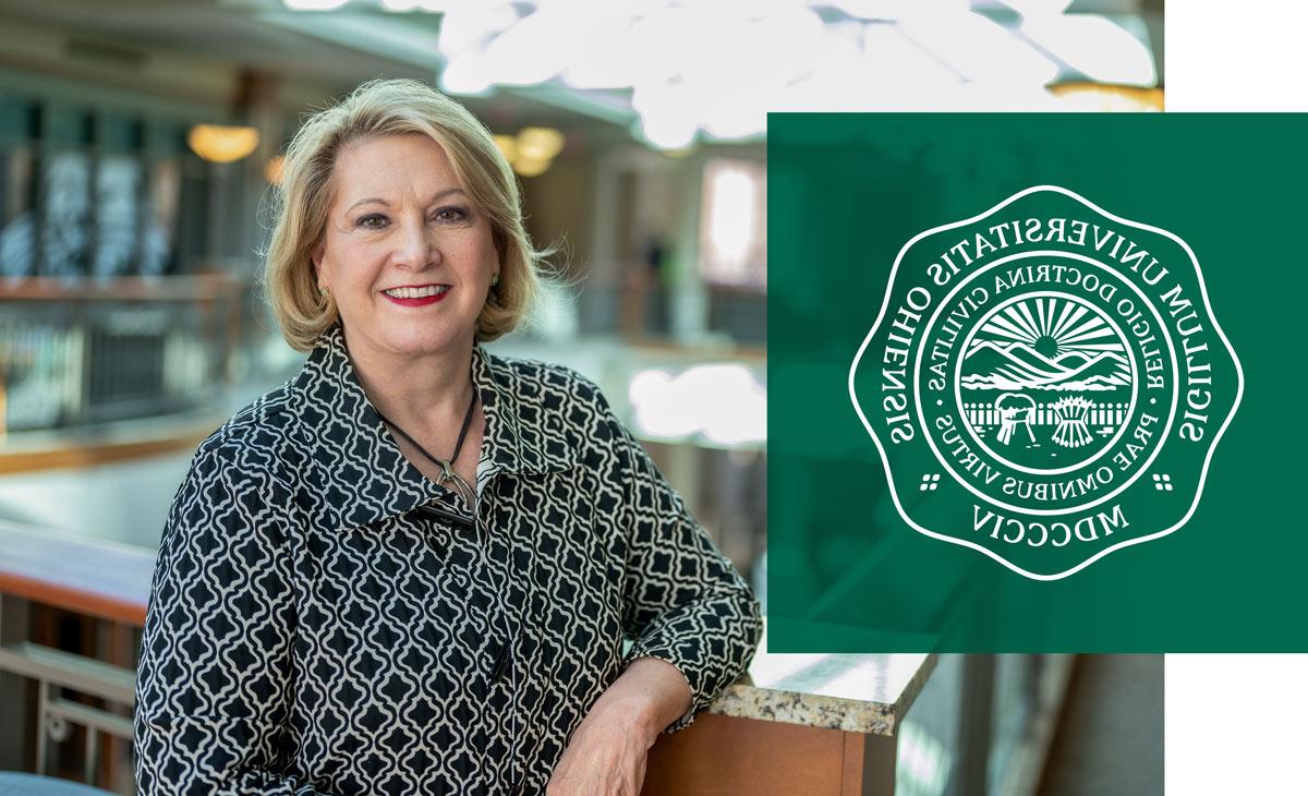 President Gonzalez standing in Baker Center with the Seal of Ohio University overlayed